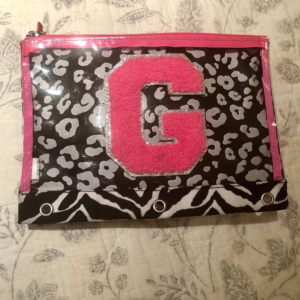 A Justic leopard/zebra print pencil pouch with a g